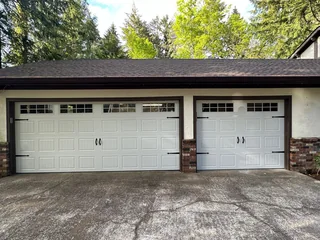 White double and single garage doors with top windows