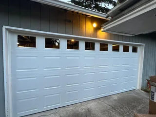 White double garage door with rectangular top windows