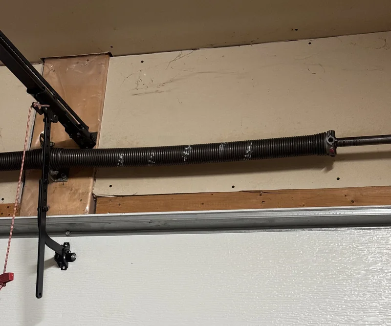Torsion spring system after garage door spring replacement